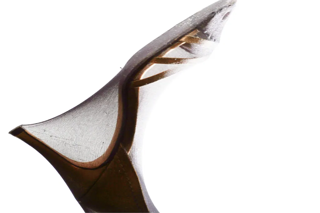 Sheer vintage stiletto with a bronze lining, photographed from below